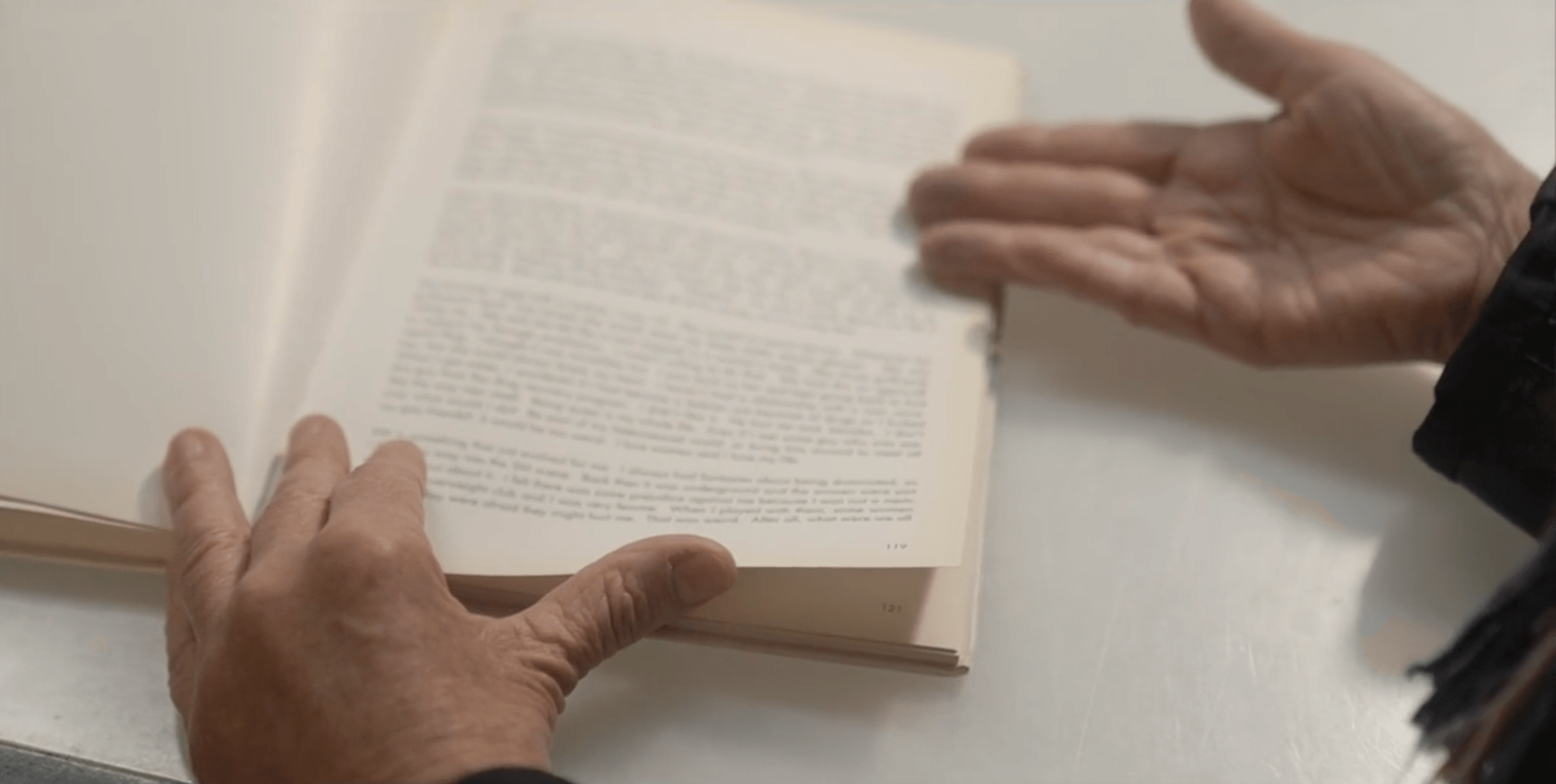 Hands holding photography book